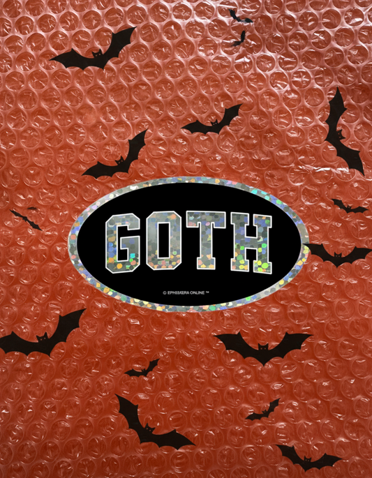 Textured red surface with a 'Goth' sticker with glitter finish in the center